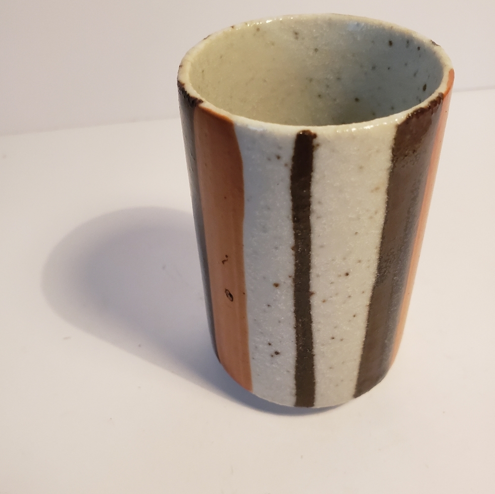 Small pottery vase or tumbler. Brown dark orange, speckled ivory glaze.